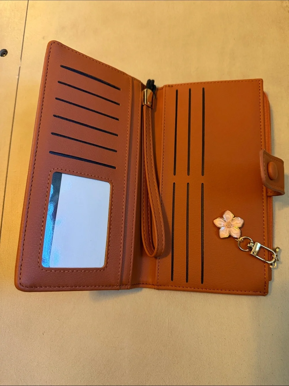 Tan Wristlet Phone Case with Flower Charm